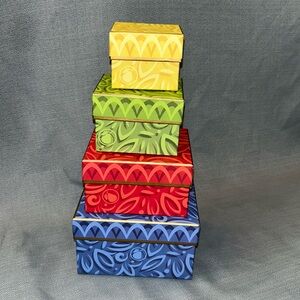 Set of 4 Harry and David gift boxes with lids. They fit inside of each other.